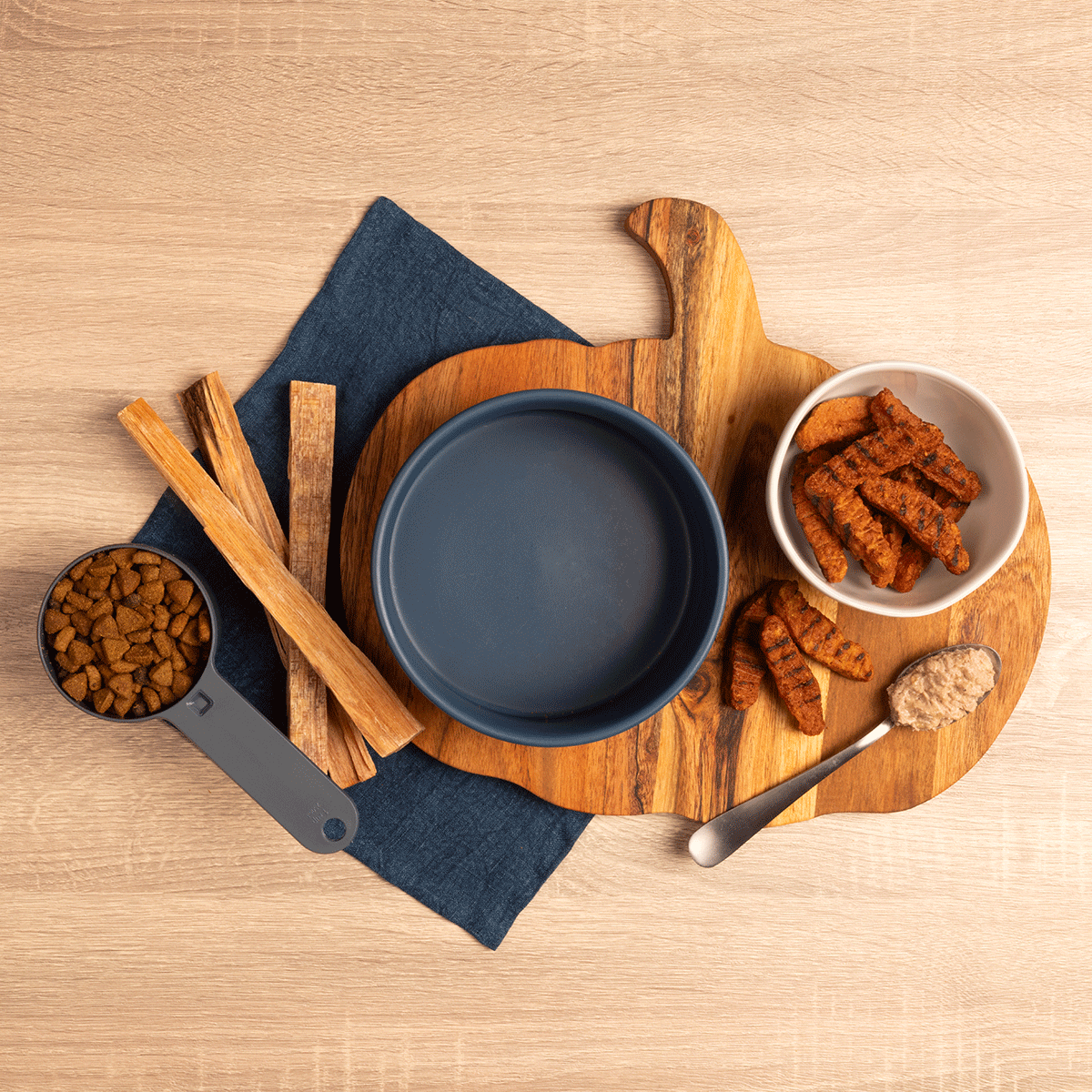 A GIF shows the ingredients being mixed to create a dog-friendly recipe.