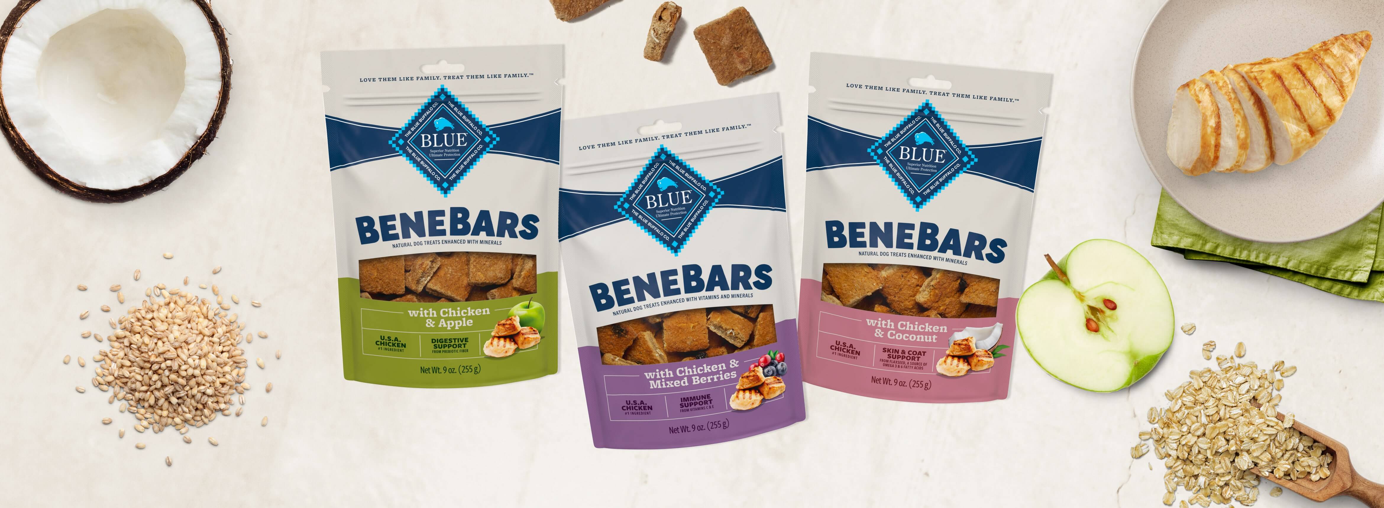 Three bags of BeneBars dog treats with apple, coconut, oats, and chicken ingredients.